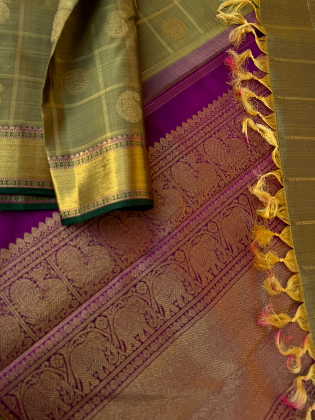 Radhee - Rare Find Kanchivarams - stunning deep elachi green and majenta mayil chackaram with solid gold zari woven borders