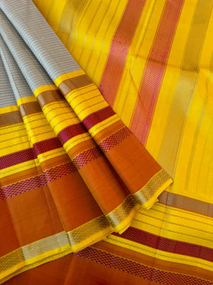 Statement of Kanchivaram - KK7 - most beautiful and most vintage style Kalakshetra no zari korvai Kanchivaram with beige muthu strips woven body with lemon yellow and burnt orange woven borders this saree is definitely rare find piece