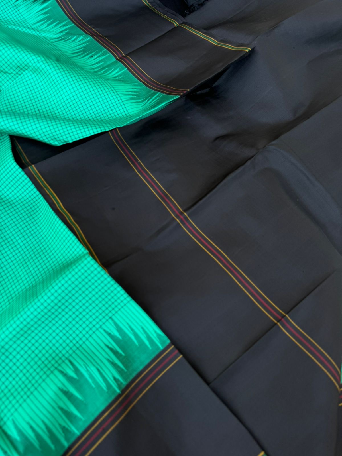 Bliss of Korvai Kanchivaram - deep mint green posi kattam woven body with black borders pallu and blouse