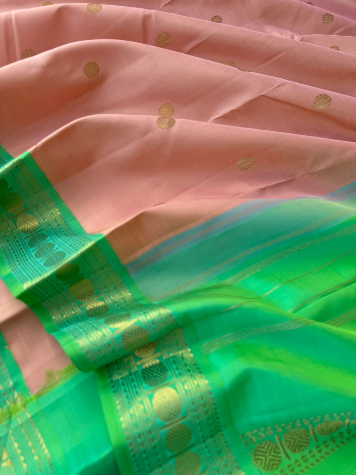 Interesting Kanchivarams - such a stunning rose gold and dual tone aqua green with small korvai woven rudurakasham borders