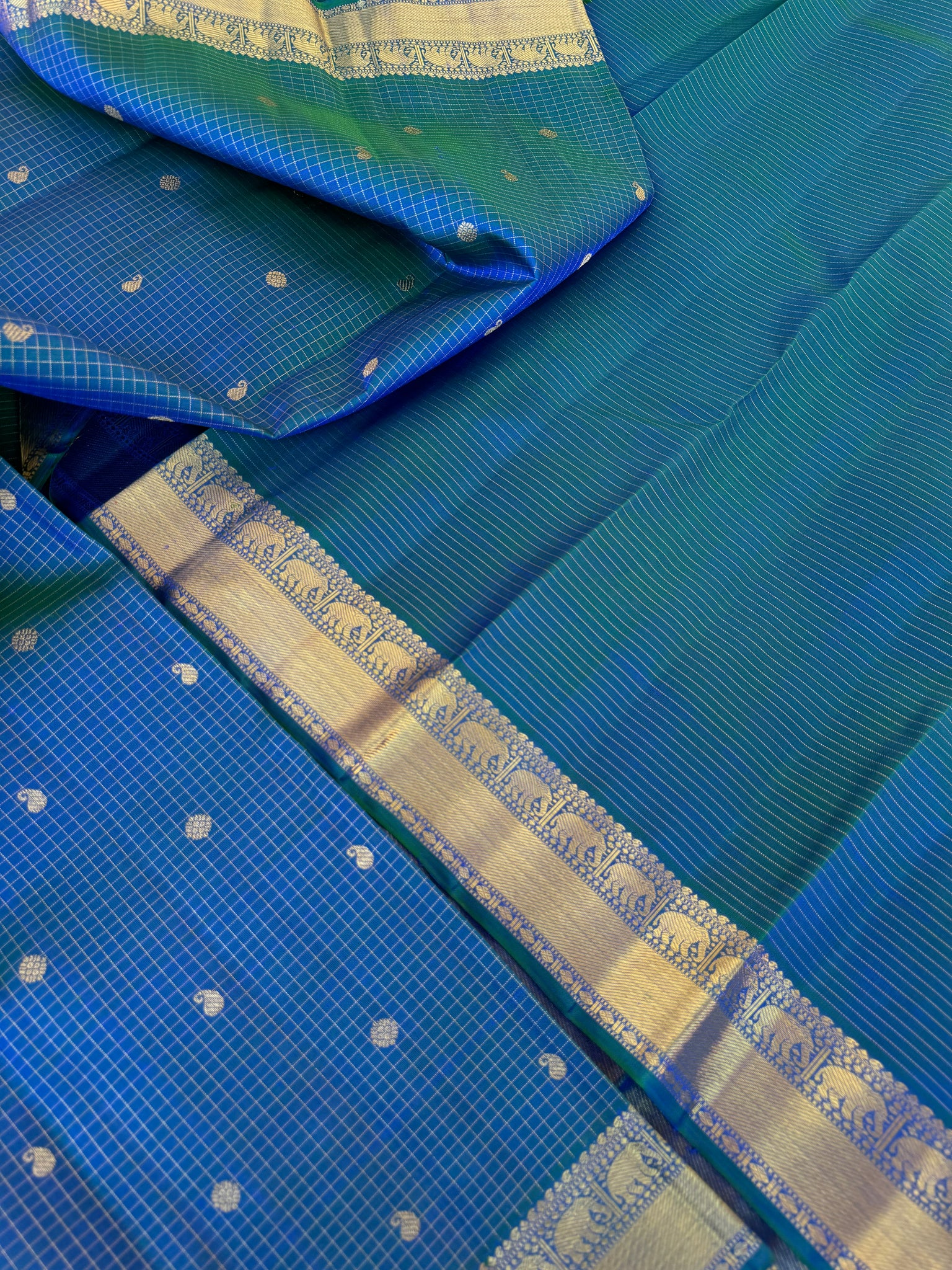 Statement of Kanchivaram - KK1 - the most beautiful dual tone peacock blue green Vairaoosi kattam with small woven borders with gorgeous grand pallu.