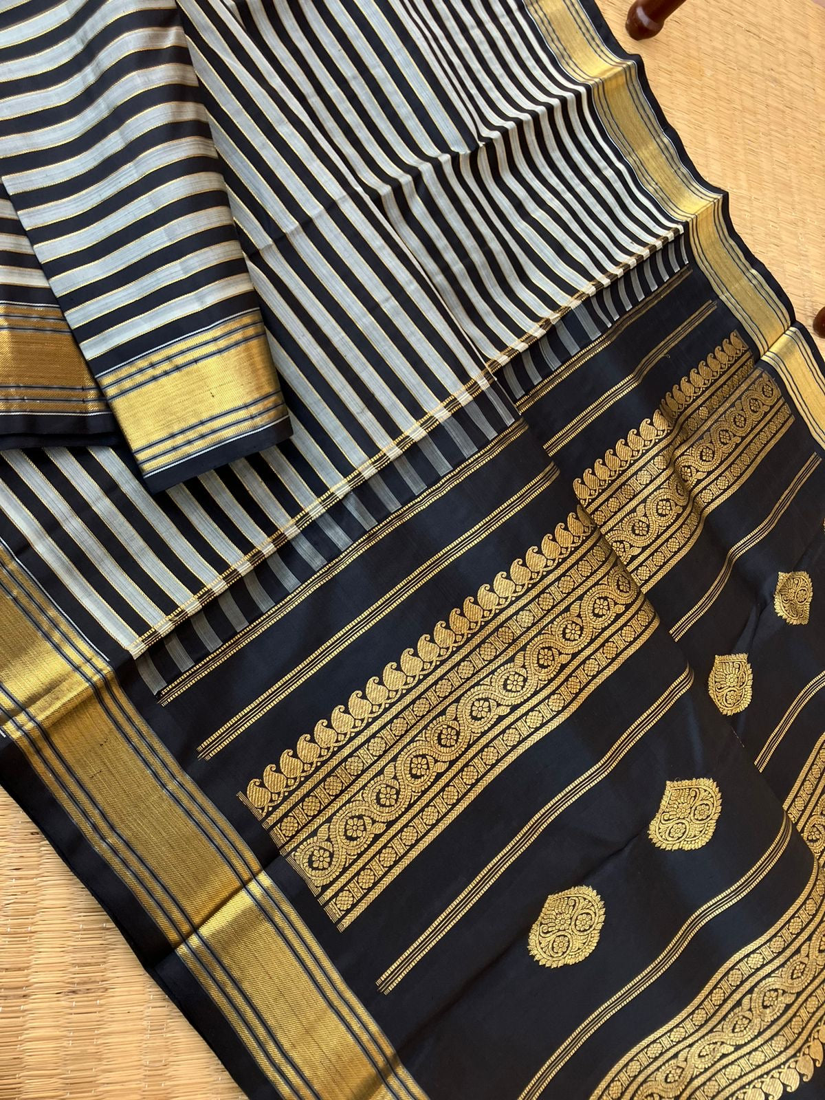 Leela - Darker effects on Kanchivaram - gorgeous black and grey stripes woven body highlighted with gold zari stripes !!