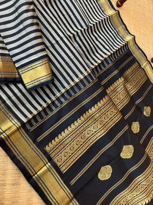 Leela - Darker effects on Kanchivaram - gorgeous black and grey stripes woven body highlighted with gold zari stripes !!