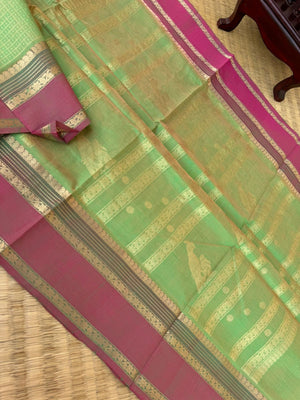 Zari Kissed Silk Cotton - pale pastel green lakshadeepam with parrots woven pallu