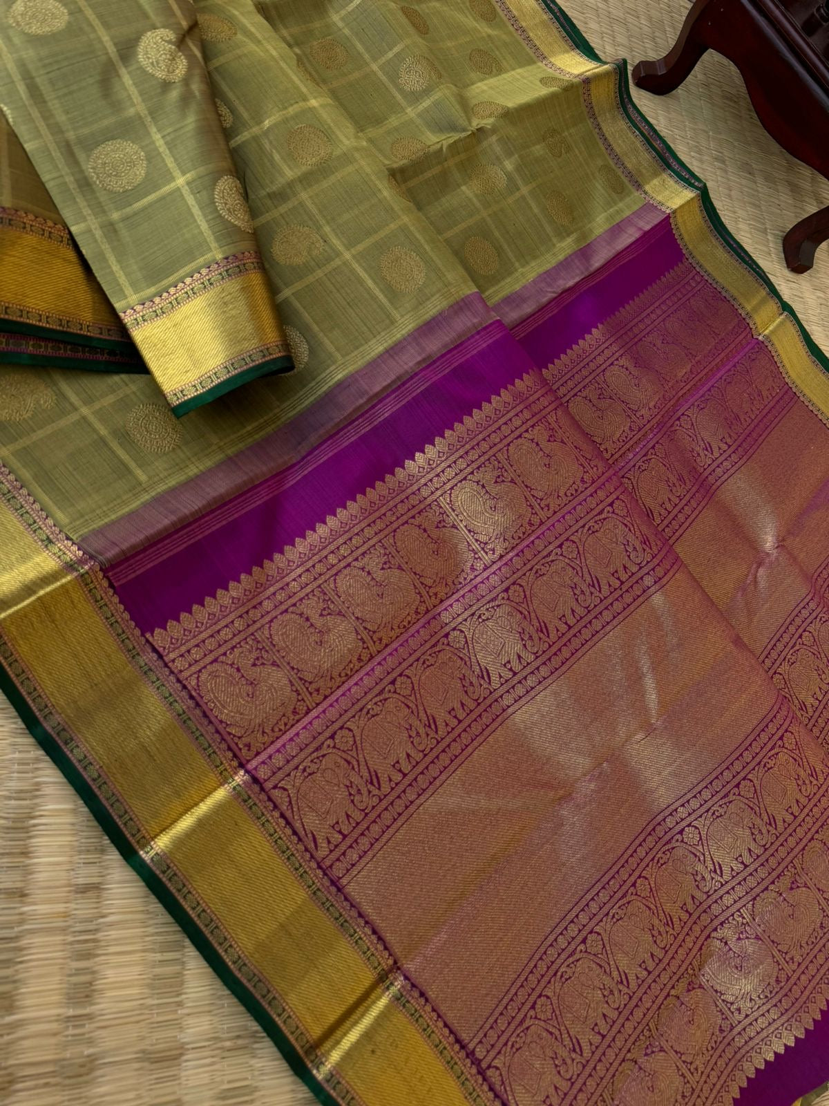 Radhee - Rare Find Kanchivarams - stunning deep elachi green and majenta mayil chackaram with solid gold zari woven borders