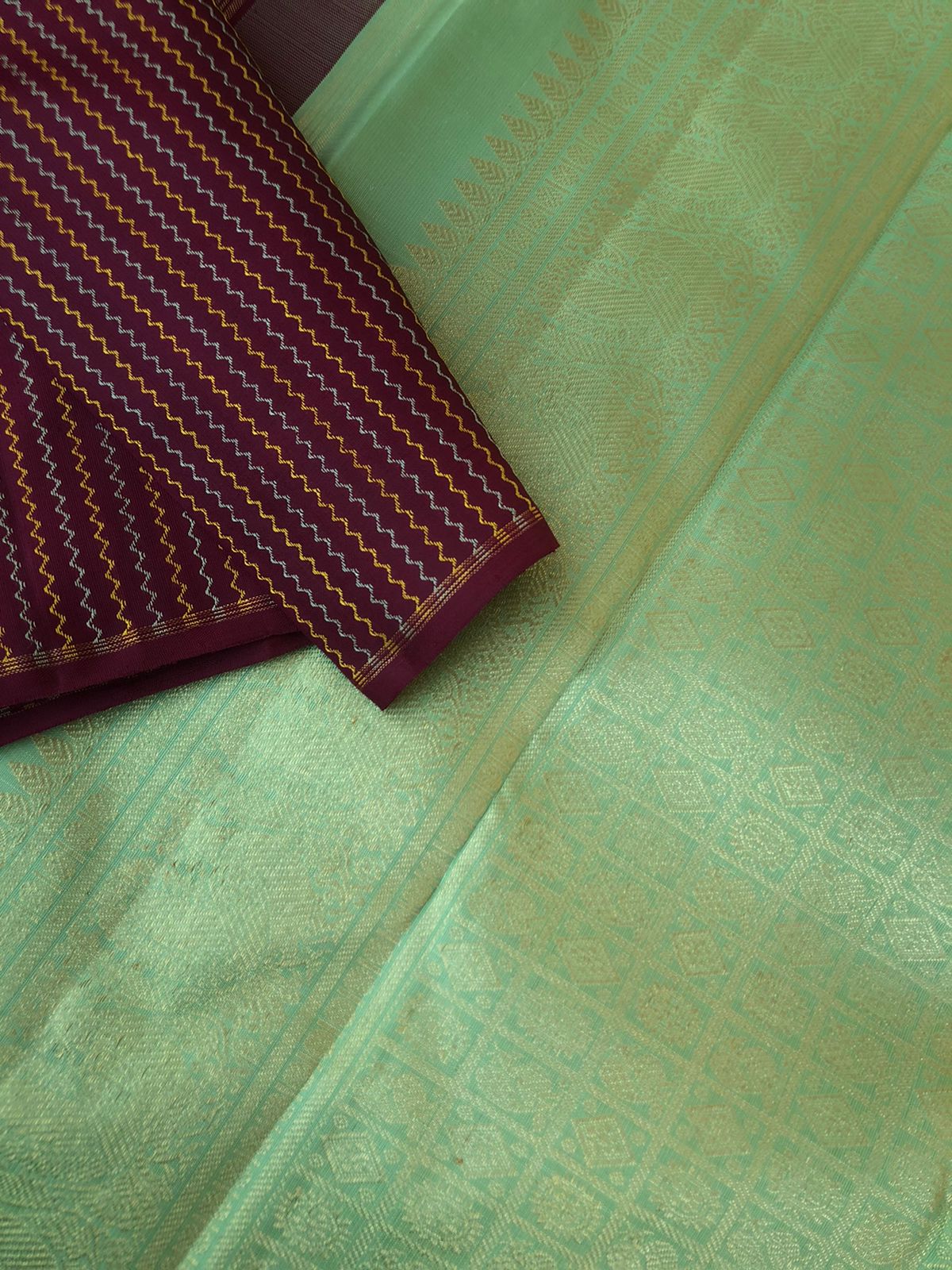 Mohaa - Beautiful Borderless Kanchivarams - deep dark coffee bean body with vertical neeli kolam weave with pista green pallu and blouse