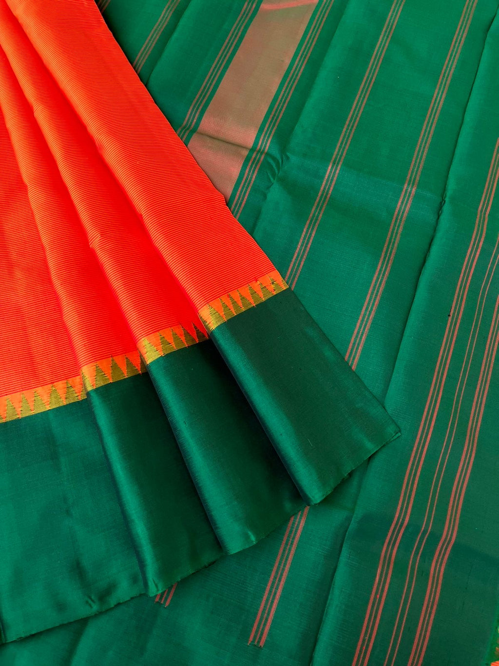 Kaavyam on Korvai Kanchivaram - burnt orange and meenakshi green