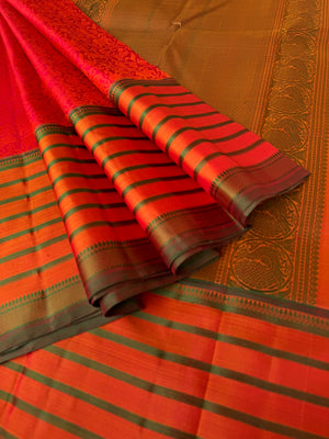 Haritham - Heirloom Yarn Play on Kanchivaram - rusty red vanasingaram woven body with varusai pett woven borders