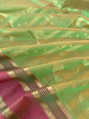 Zari Kissed Silk Cotton - pale pastel green lakshadeepam with parrots woven pallu