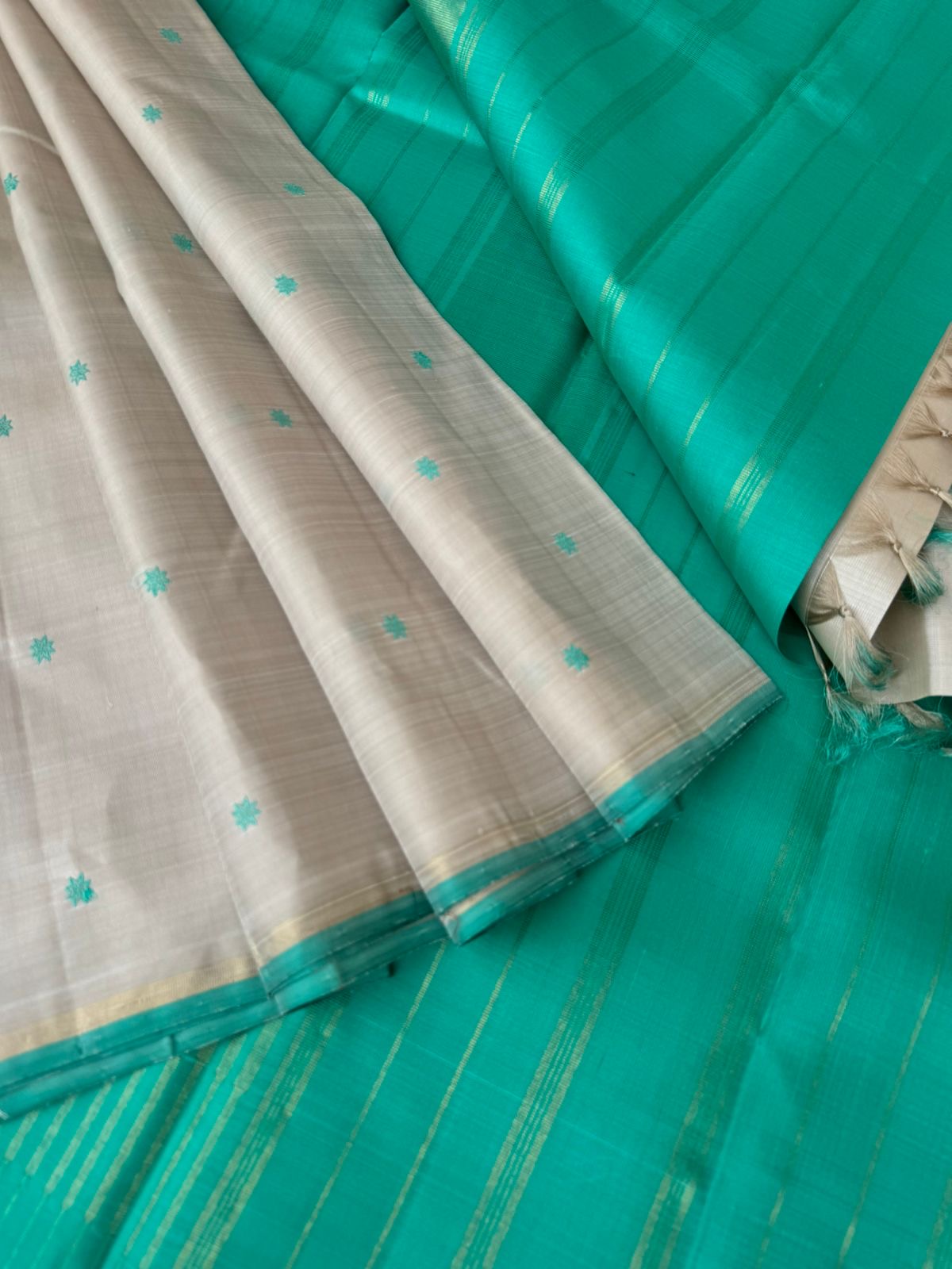 Bliss of Kanchivaram - calcium pale off white with aqua blue green with buttas woven body