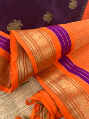 Meenakshi - Kanchivaram for Every Occasion - the most beautiful combination of betel-nut maroon and orange koravi Kanchi with irruthalaipakshi woven buttas