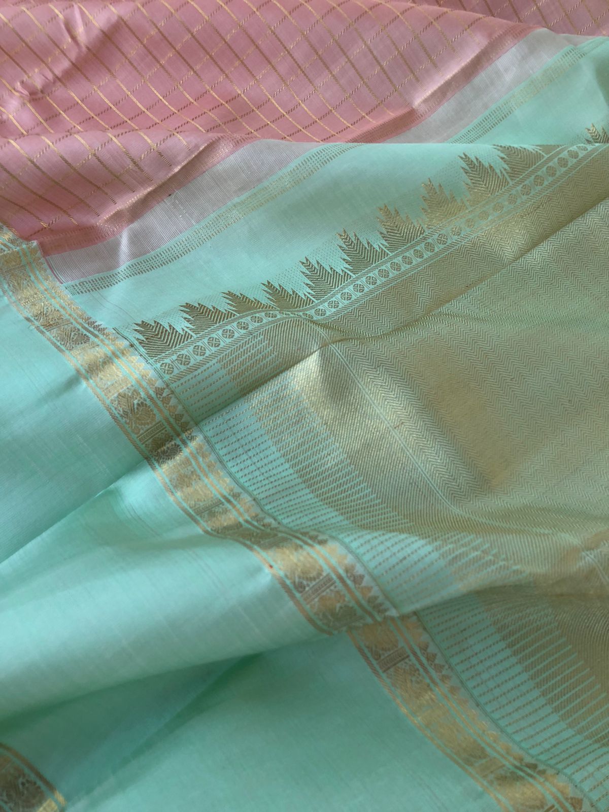 Pastel Ragas on Kanchivaram - dusky pastel rose gold muthukattam with 8 koll gold zari woven pallu