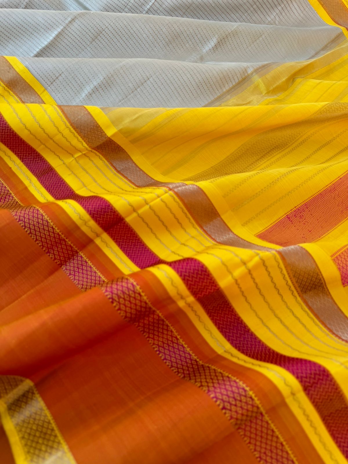 Statement of Kanchivaram - KK7 - most beautiful and most vintage style Kalakshetra no zari korvai Kanchivaram with beige muthu strips woven body with lemon yellow and burnt orange woven borders this saree is definitely rare find piece