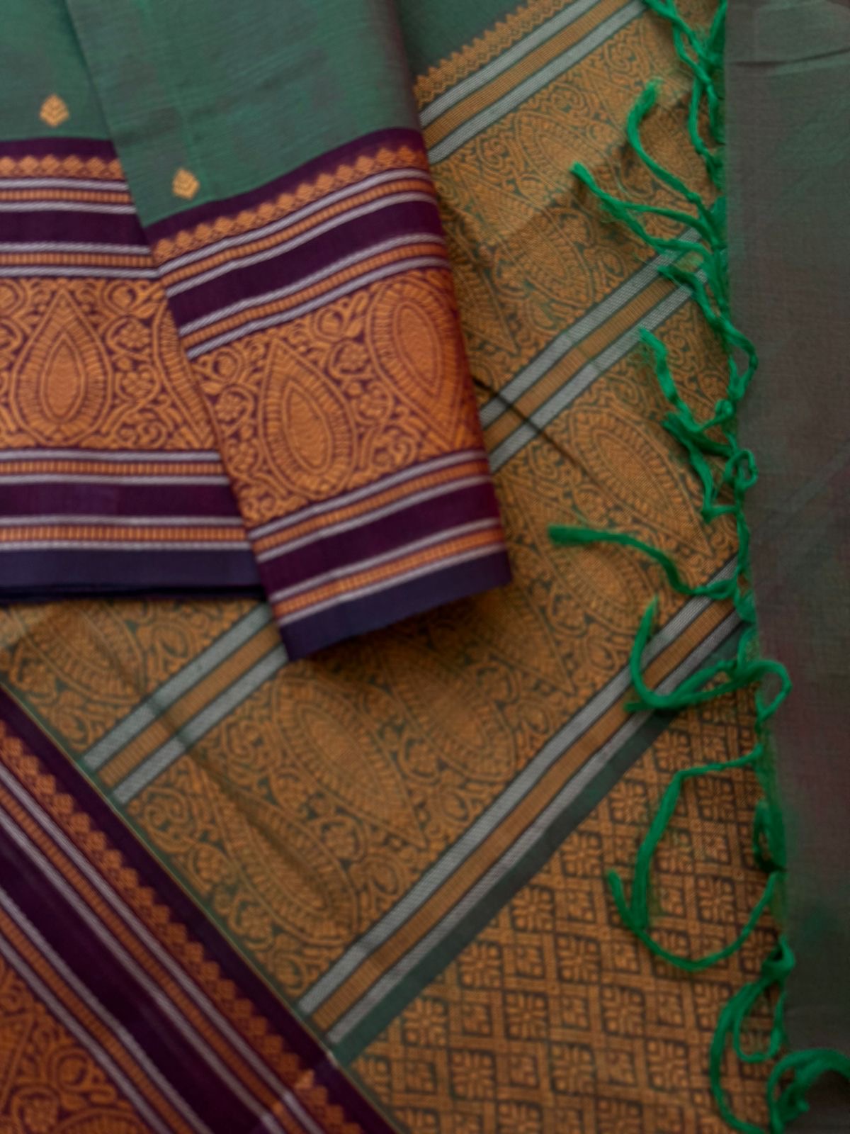 Mangalavastaram - Deep dark maanthulir green with mustard orange woven borders