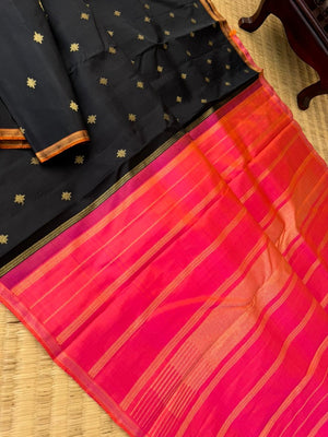 It is all about borderless kanchivarams - black body with orange short pink pallu and blouse