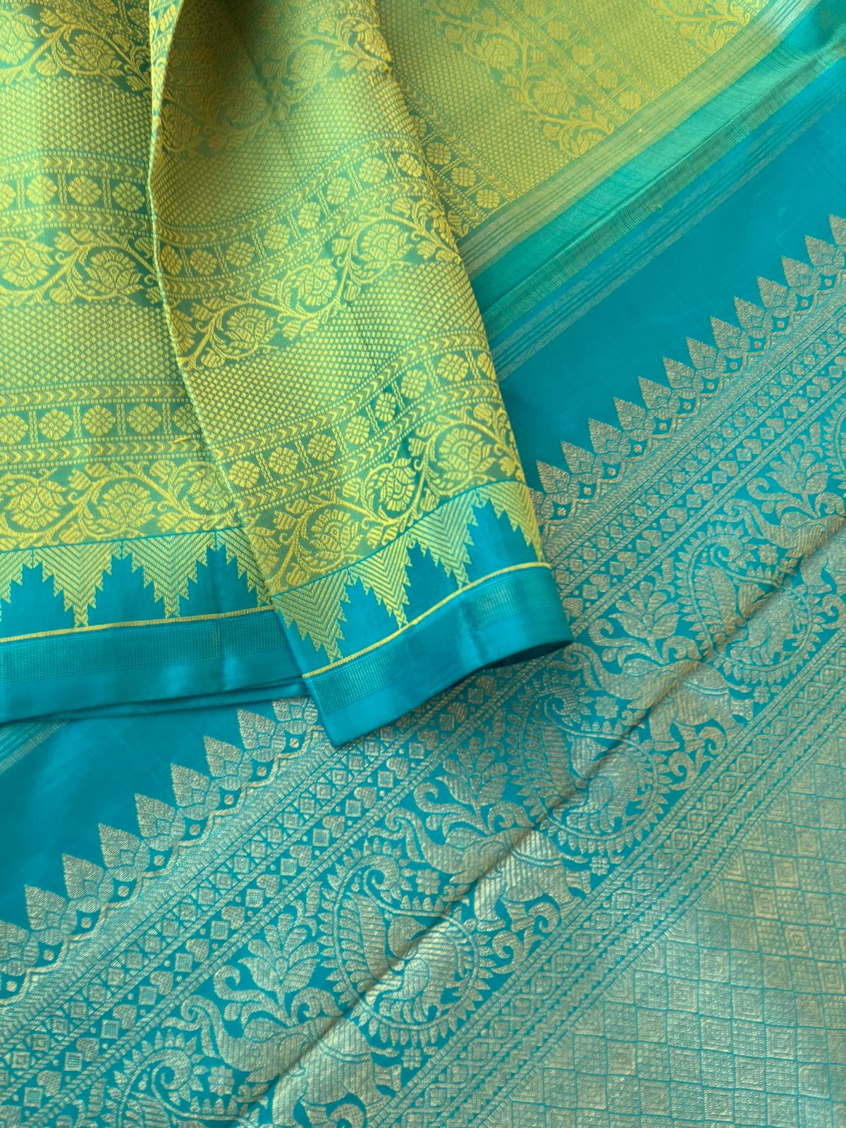 Colour Effects of Kanchivaram - the most beautiful pastel green thread woven varusai pett body with teal zari woven pallu