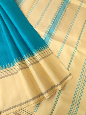 Kaavyam on Korvai Kanchivaram - gorgeous turquoise blue and creamy off white ( venn pattu ) tone borders pallu and blouse