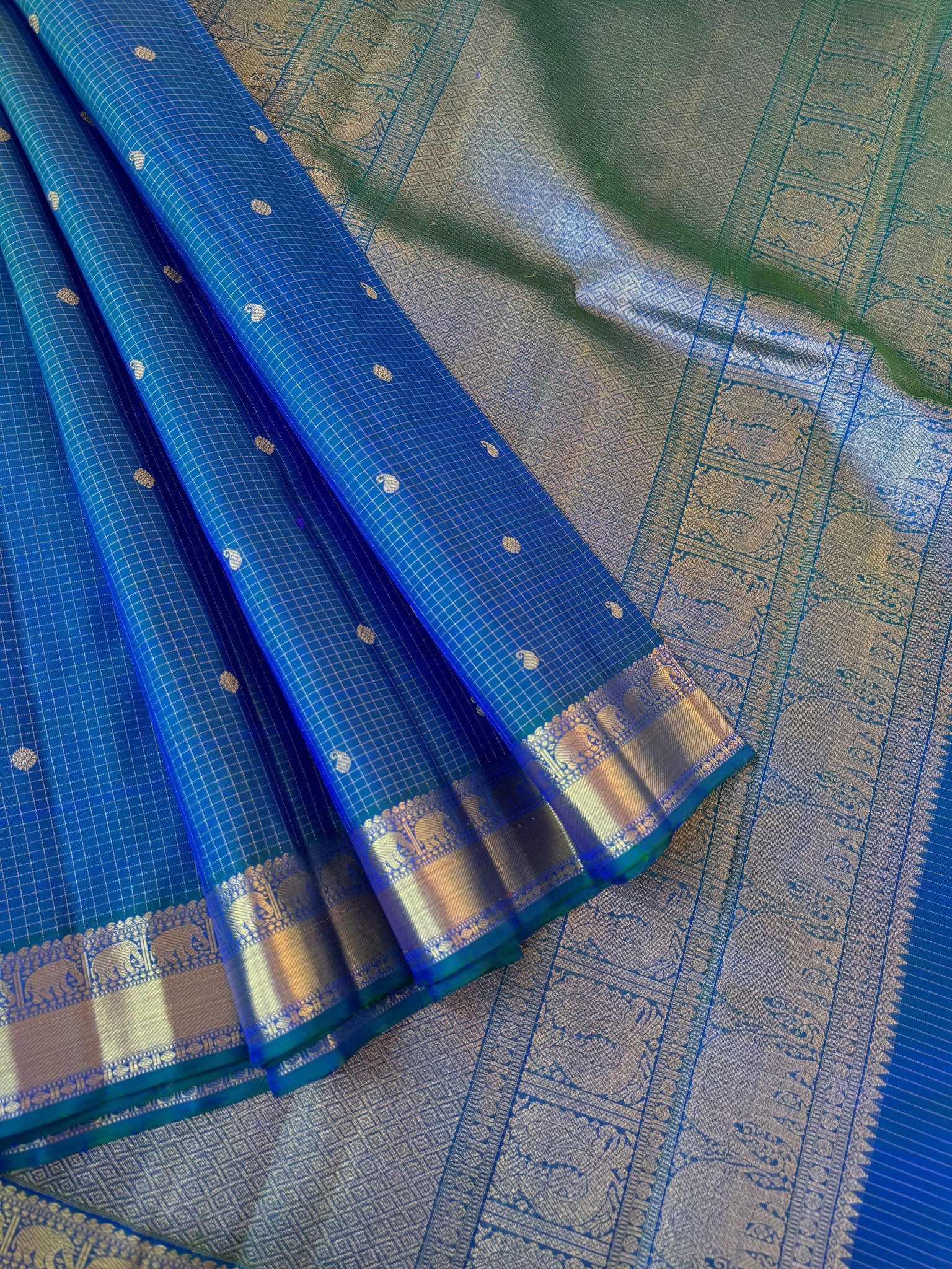 Statement of Kanchivaram - KK1 - the most beautiful dual tone peacock blue green Vairaoosi kattam with small woven borders with gorgeous grand pallu.