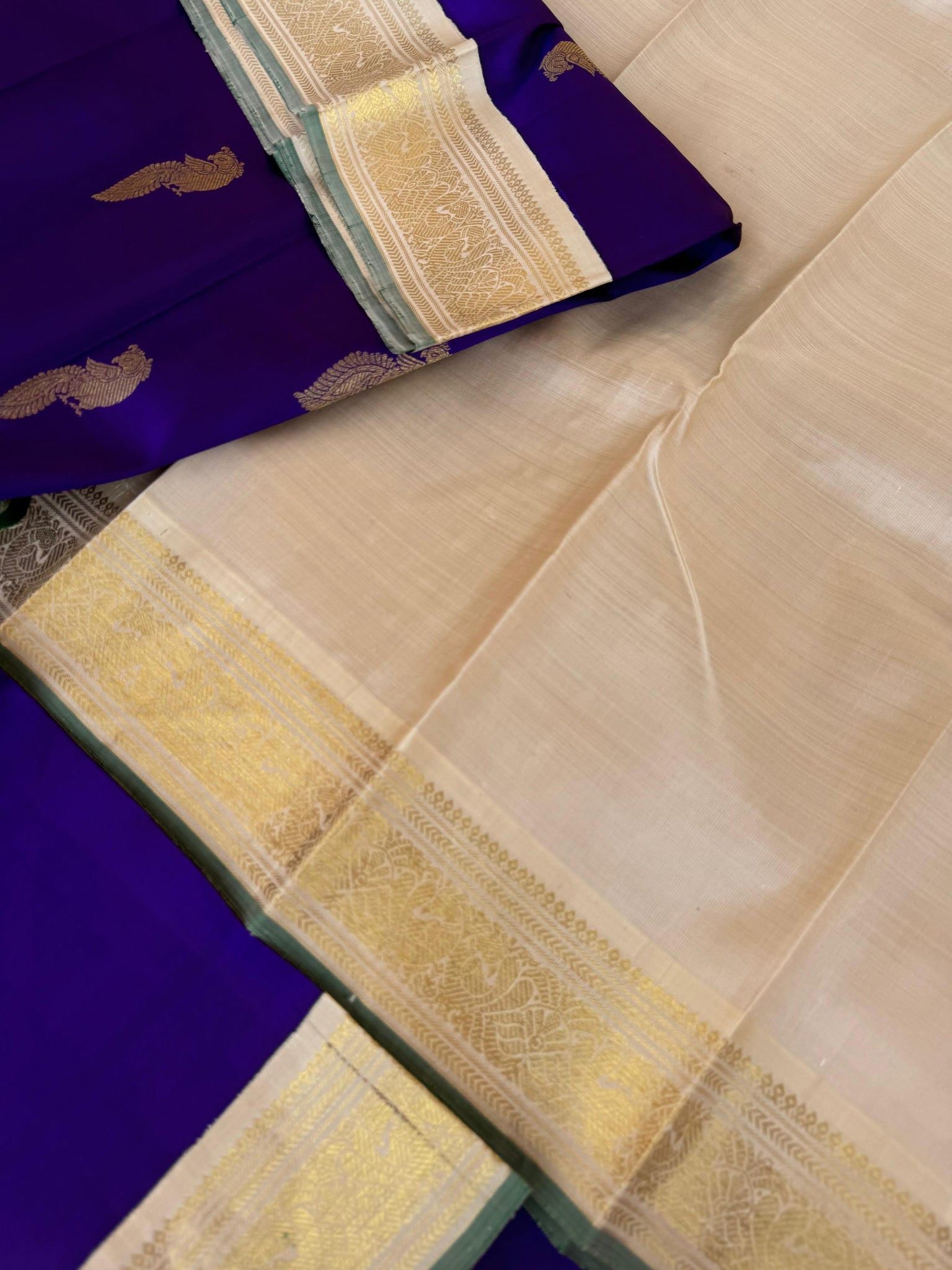 Tales of Korvais Kanchivaram - stunning violet and gold ivory with parrots woven buttas