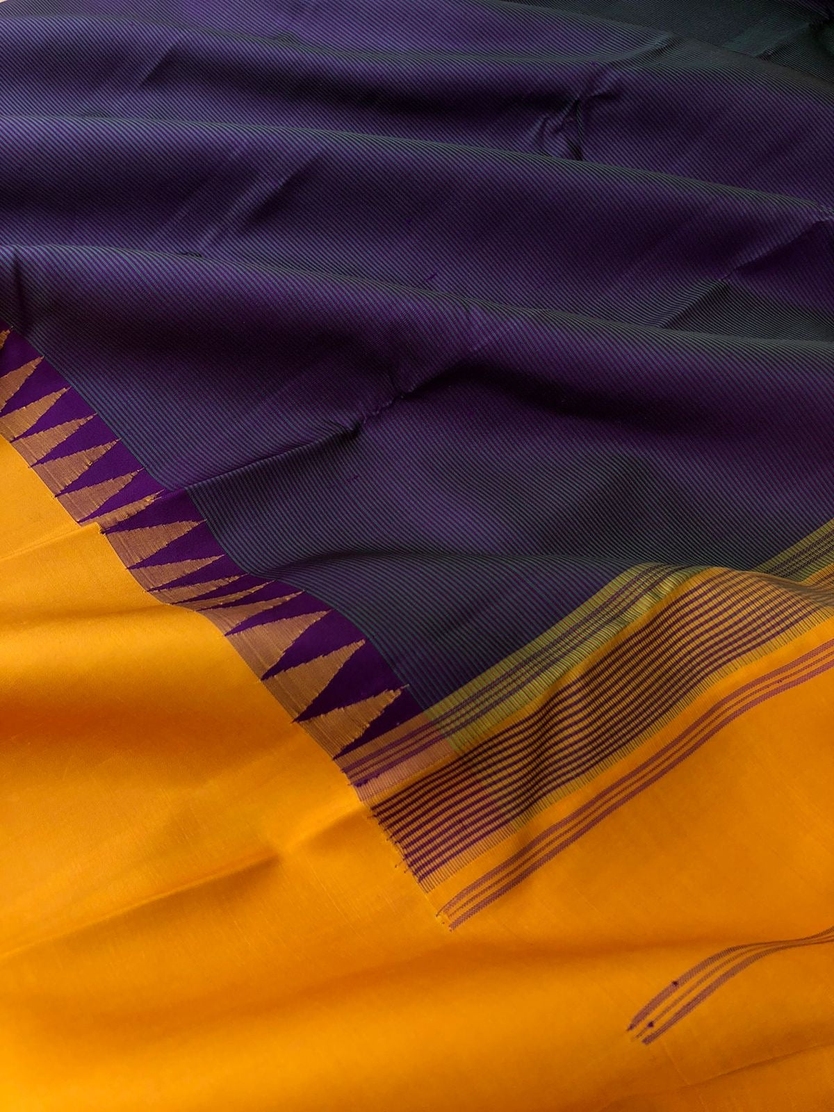 Kaavyam on Korvai Kanchivaram - unusual deep dark purple short green with mustard woven borders