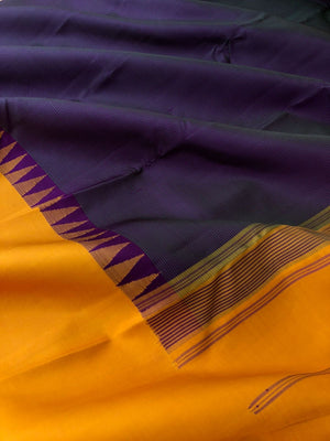 Kaavyam on Korvai Kanchivaram - unusual deep dark purple short green with mustard woven borders