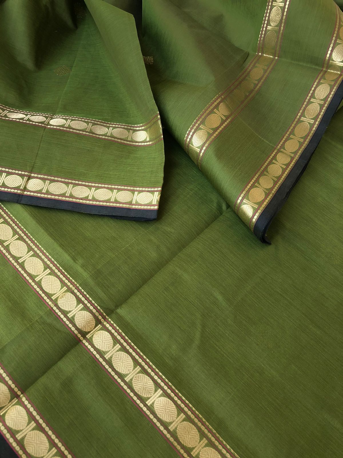 Zari Kissed Silk Cotton - stunning olive green kolam buttas with retta pett woven borders