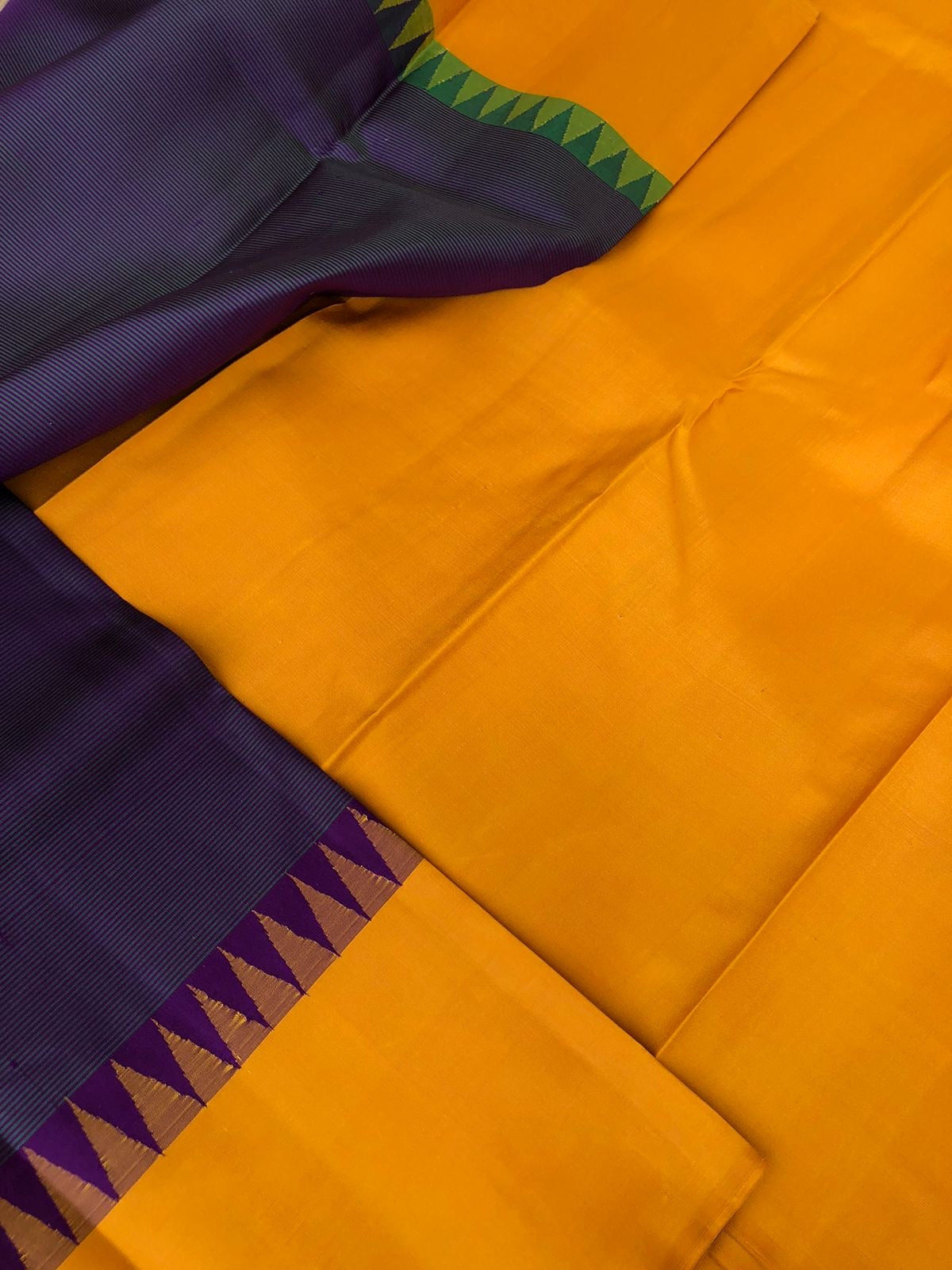 Kaavyam on Korvai Kanchivaram - unusual deep dark purple short green with mustard woven borders