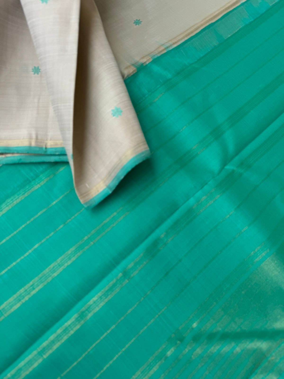 Bliss of Kanchivaram - calcium pale off white with aqua blue green with buttas woven body