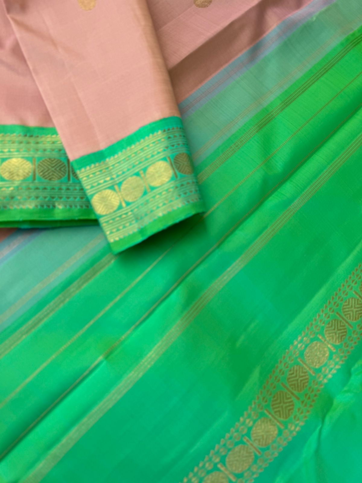 Interesting Kanchivarams - such a stunning rose gold and dual tone aqua green with small korvai woven rudurakasham borders