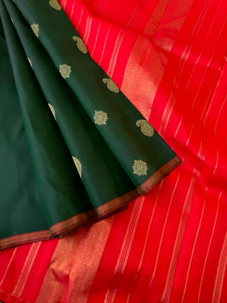 It is all about borderless kanchivarams - deep dark forest green and red