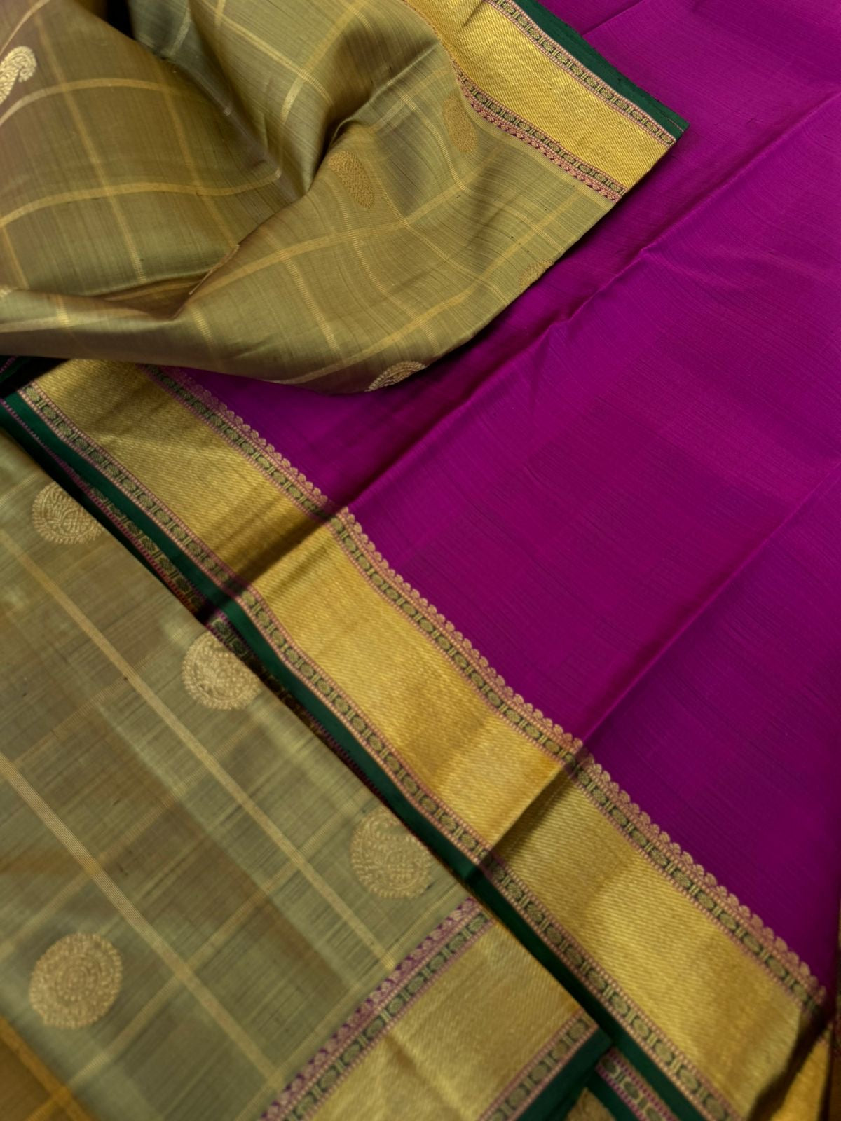 Radhee - Rare Find Kanchivarams - stunning deep elachi green and majenta mayil chackaram with solid gold zari woven borders