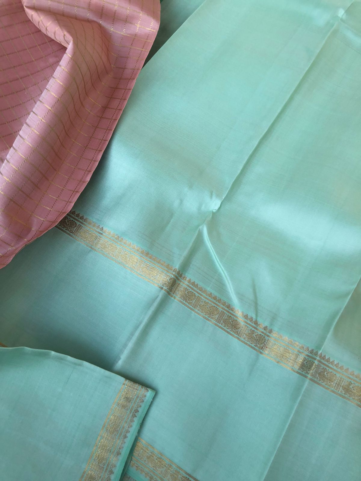 Pastel Ragas on Kanchivaram - dusky pastel rose gold muthukattam with 8 koll gold zari woven pallu