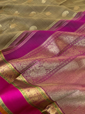 Heriyae - Molten Mettalic Kanchivarams - gorgeous metallic fenugreek bronze tone paisley and annapakshi woven buttas with majenta purple elephant motifs borders with grandest pallu