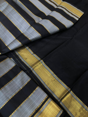 Radhee - Rare Find Kanchivarams - stunning black and grey train track veldhari body with gold zari borders and pallu