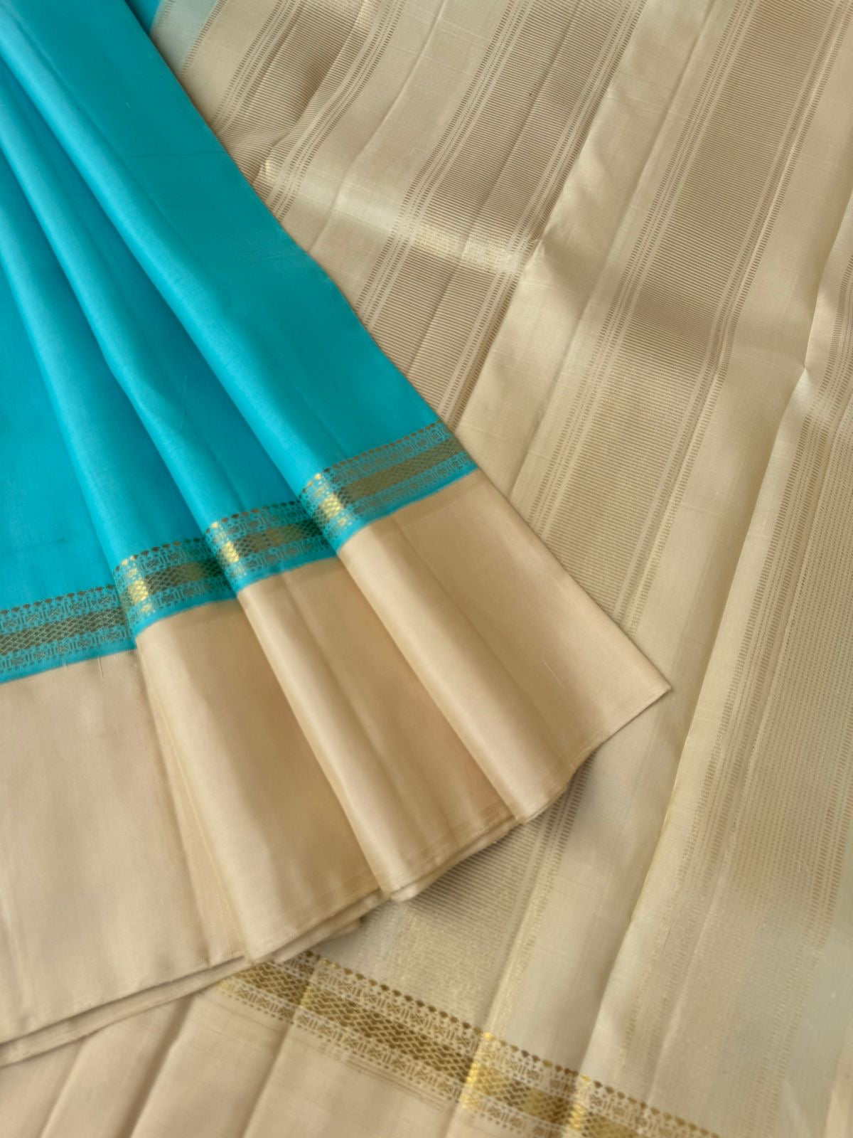 Interesting Kanchivarams - omg !! A beautiful turquoise blue and cream!! Out of the world