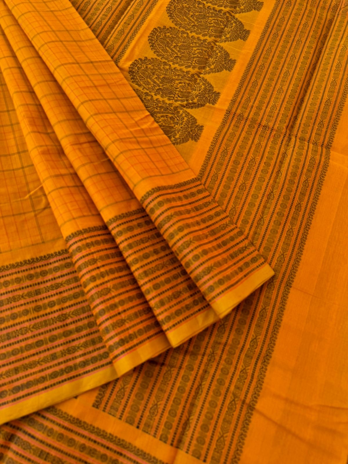 Mangalavastaram - traditional mustard chex woven body with fish pett woven borders