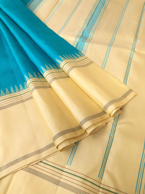 Kaavyam on Korvai Kanchivaram - gorgeous turquoise blue and creamy off white ( venn pattu ) tone borders pallu and blouse