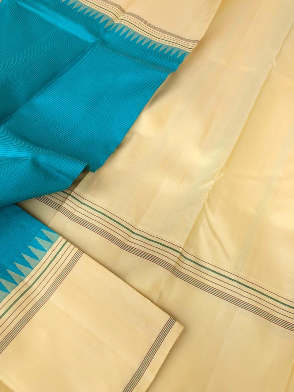 Kaavyam on Korvai Kanchivaram - gorgeous turquoise blue and creamy off white ( venn pattu ) tone borders pallu and blouse