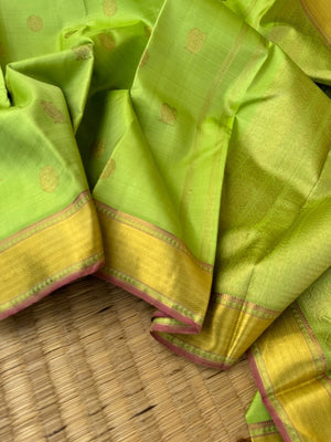 Pastel Ragas on Kanchivaram - pastel apple green Vairaoosi with Mayil chackaram woven buttas