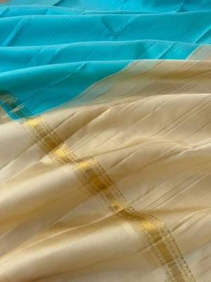 Interesting Kanchivarams - omg !! A beautiful turquoise blue and cream!! Out of the world