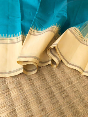 Kaavyam on Korvai Kanchivaram - gorgeous turquoise blue and creamy off white ( venn pattu ) tone borders pallu and blouse