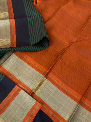 Heriyae - Molten Mettalic Kanchivarams - stunning metallic black and dark green vaari and kattam woven body with rust orange pallu and blouse