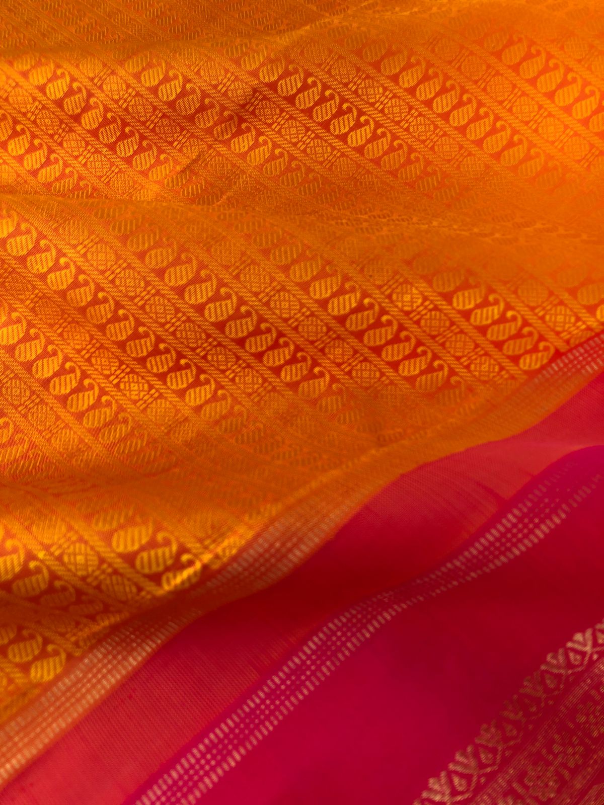 Yarn Play on Kanchivaram - sun set orange mustard with full body paisley and rudurakasham woven motifs with pink palllu and blouse