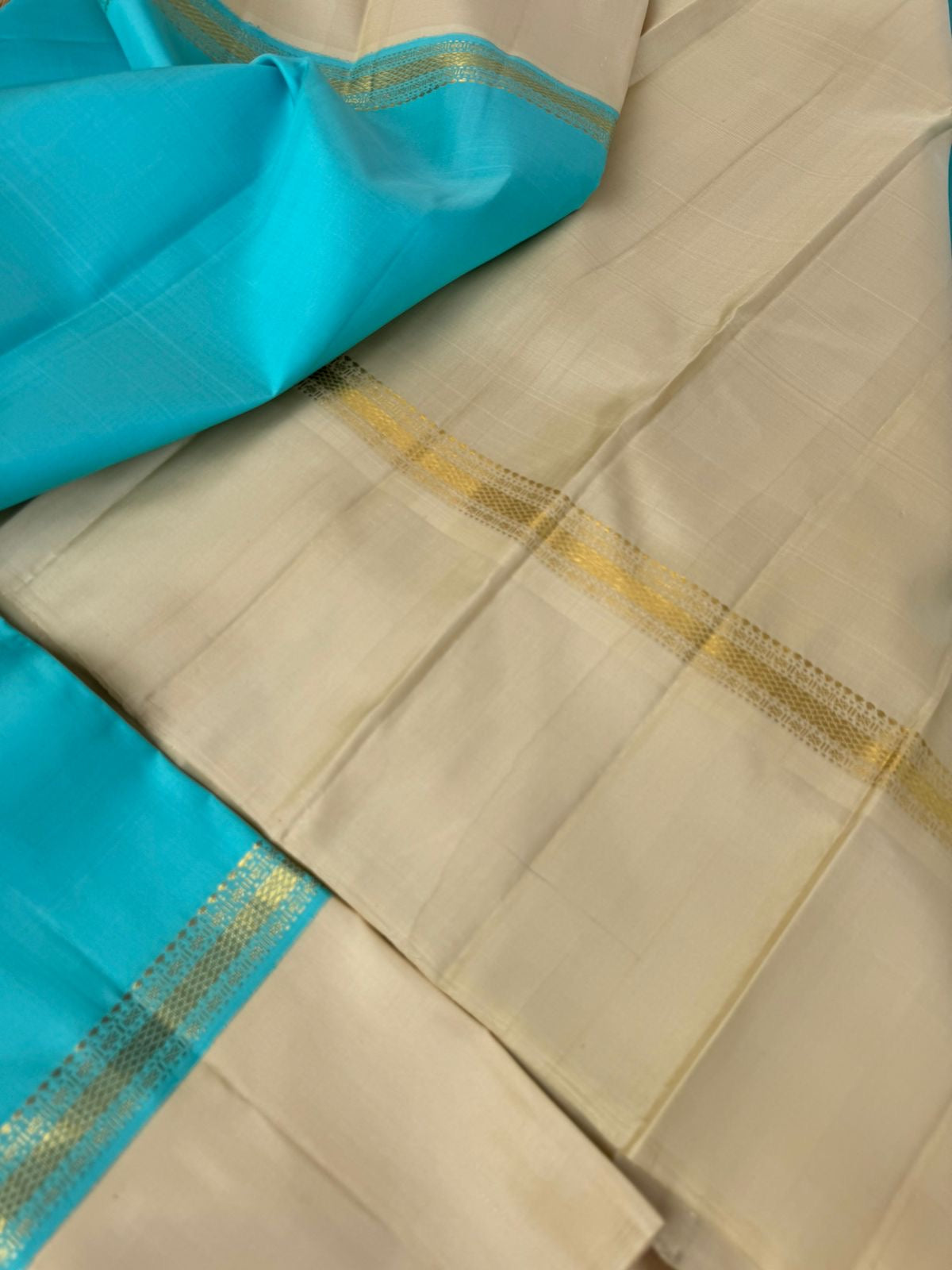 Interesting Kanchivarams - omg !! A beautiful turquoise blue and cream!! Out of the world