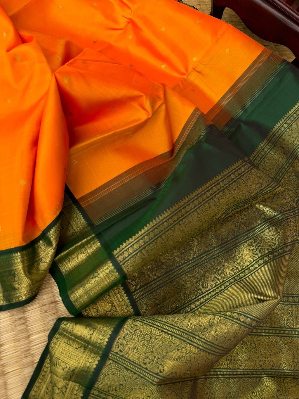 Connected by Korvais on Kanchivaram - the beauty of gorgeous orange and Meenakshi green with yali and annapakshi woven borders