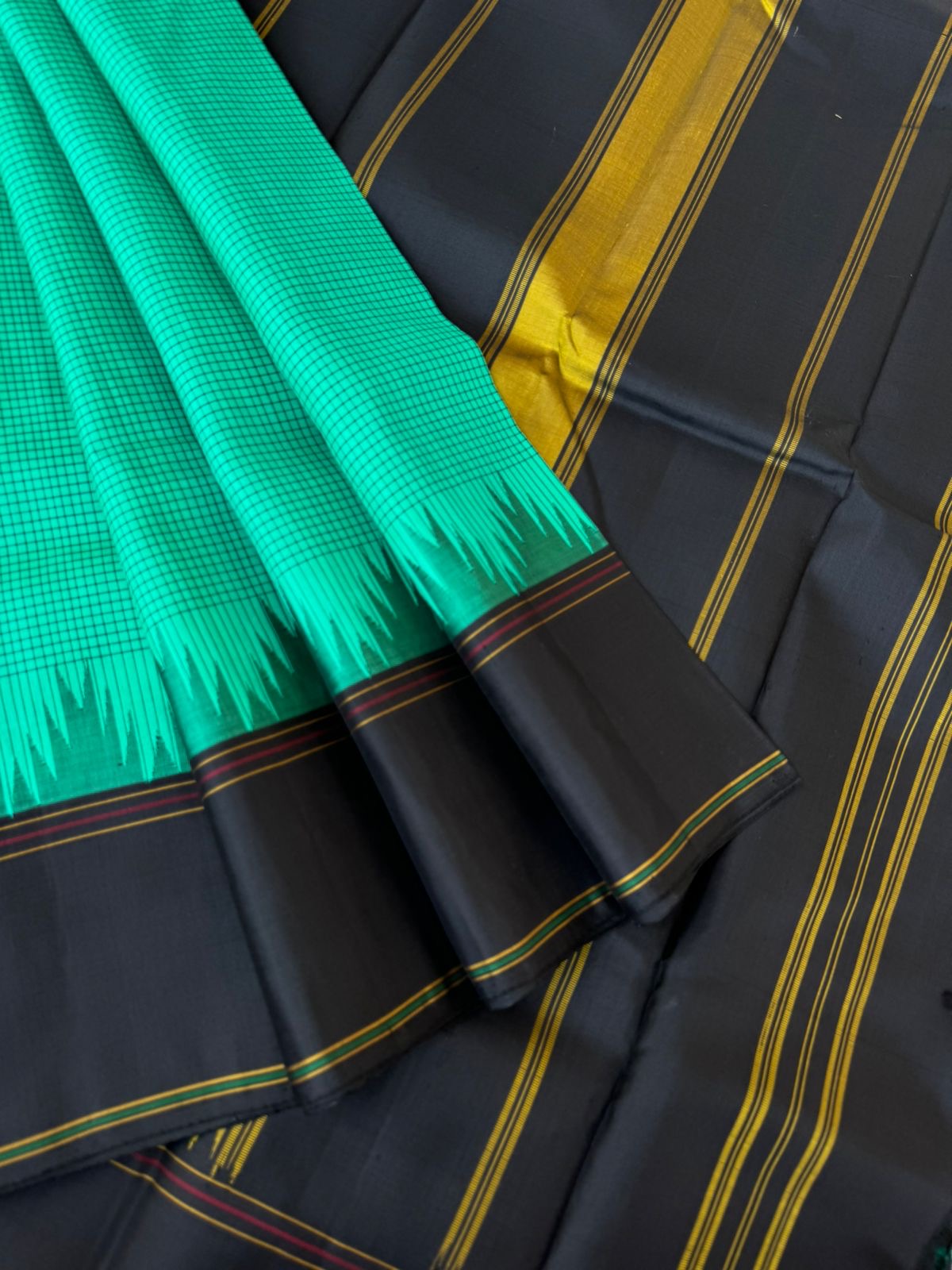 Bliss of Korvai Kanchivaram - deep mint green posi kattam woven body with black borders pallu and blouse