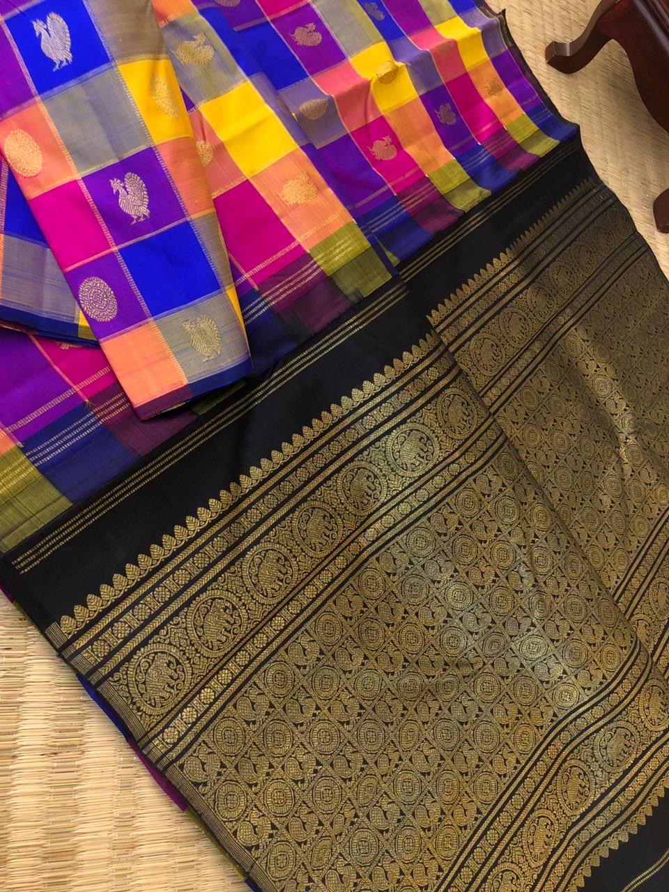 Paalum Palamum Kattam on Kanchivarams - amazing mix of blue violet pink and mustard chex woven body with black pallu and blouse