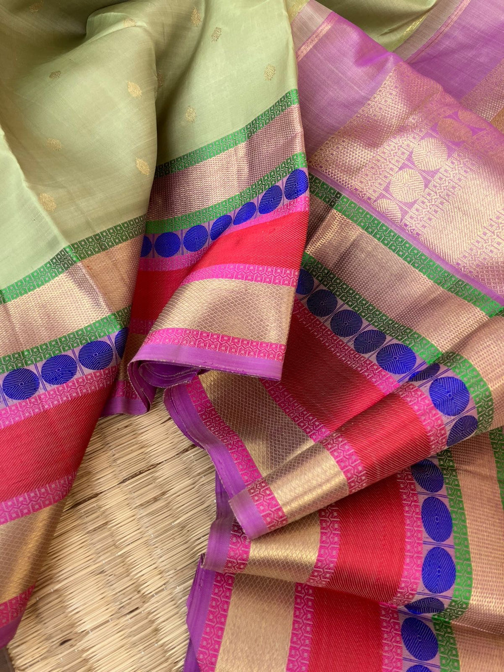 Statement of Kanchivaram - Something Different - most beautiful pastel pista green with zari and thread woven varusai pett borders