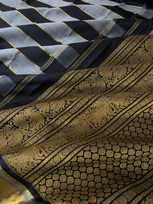 Radhee - Rare Find Kanchivarams - stunning black and grey train track veldhari body with gold zari borders and pallu