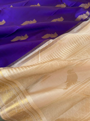 Tales of Korvais Kanchivaram - stunning violet and gold ivory with parrots woven buttas